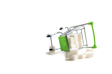 Miniature cart from the supermarket. Refined sugar. The problem of diabetes. The use of sugar.