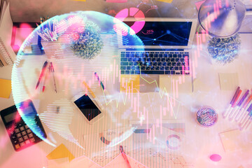 Business theme hologram drawings over computer on the desktop background. Top view. Multi exposure. Concept of international connections.