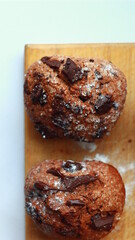chocolate muffins closeup on the wooden board
