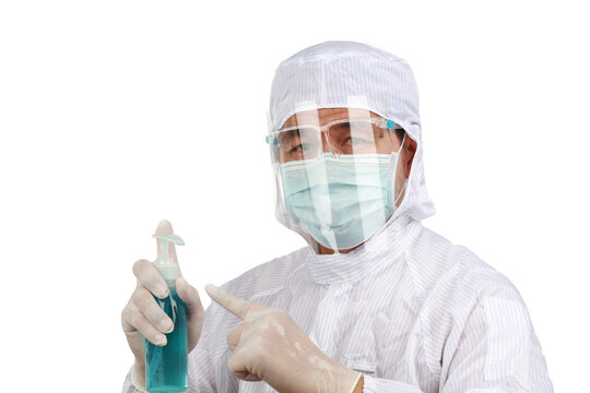 Hospital staff wearing full PPE hollding algohol gel to flighting with Corona Virus