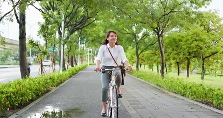 Asian woman commute by bicycle