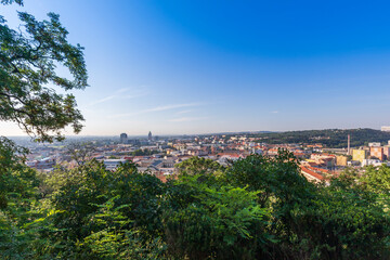 A view of the city of Brno in the Czech Republic in Europe. In the background is a blue sky with clouds.
