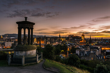 Naklejka premium Edinburgh city view from Calton Hill at sunset, Scotland