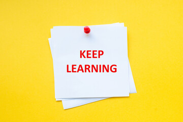 Keep learning. Motivational Business. Motivational slogan on white sticker with yellow background