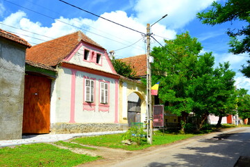 Fototapeta na wymiar Typical rural landscape and peasant houses in Drauseni, Transylvania,Romania. The settlement was founded by the Saxon colonists in the middle of the 12th century