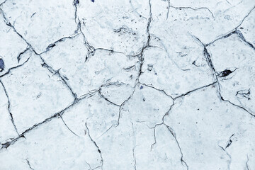 Distressed overlay texture of cracked concrete, stone or asphalt. Grunge background. Abstract illustration