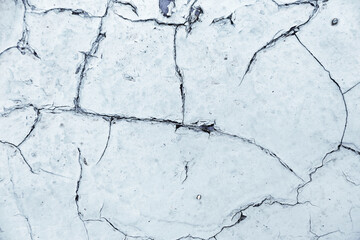 Distressed overlay texture of cracked concrete, stone or asphalt. Grunge background. Abstract illustration