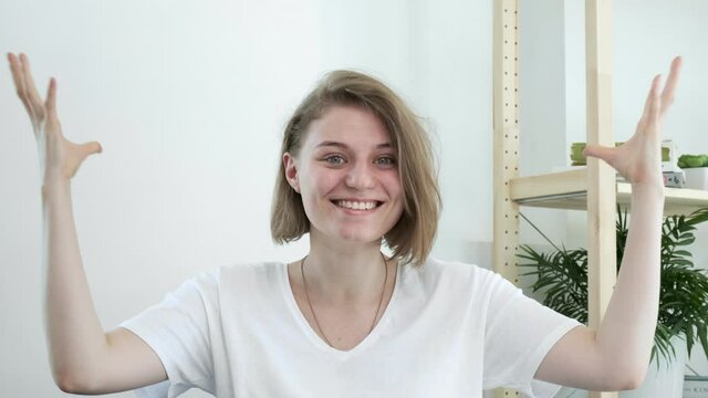 Mindblown reaction of millennial girl expressing astonishment, thrilling excitement. happy young caucasian woman in inexplicable situation, gesture of mind blown. She never expected this and surprised