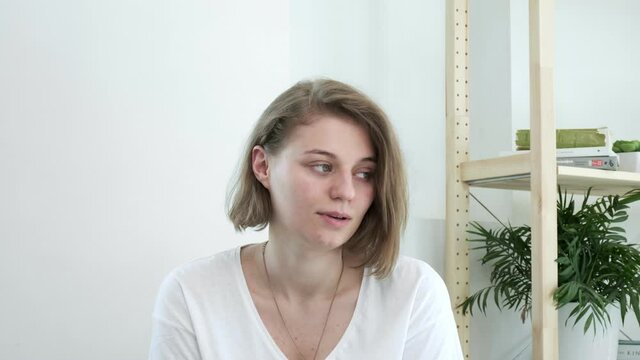 Mindblown reaction of upset millennial girl expressing shock. young caucasian woman in shocking situation, gesture of mind blown. She never expected this, she is annoyed, dissatisfied, disappointed
