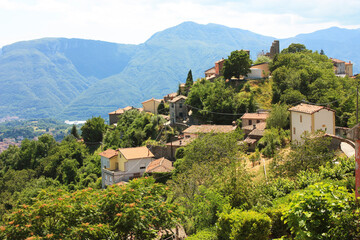 top view of an ancient medieval Tuscan village in the green of the rural countryside in the hills