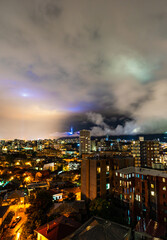 Fototapeta na wymiar Dramatic night sky over Tbilisi city