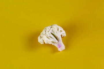Fototapeta na wymiar fresh cauliflower isolated yellow background
