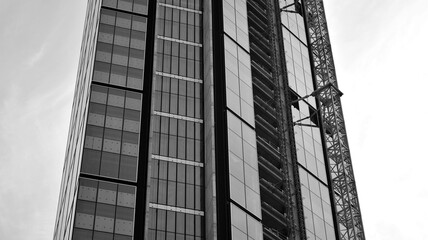 High-rise building under construction. Modern office building. Black and white.