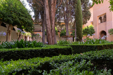 Interior and exterior of the historical building Alhambra, in Granada, Spain in a sunny day in 2020.