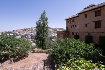 Fototapeta na wymiar Interior and exterior of the historical building Alhambra, in Granada, Spain in a sunny day in 2020.