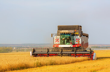 Harvesting combine in field