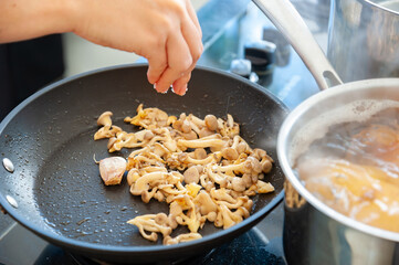 chef preparing food in pan