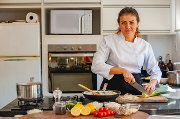 Fototapeta na wymiar young woman cooking in kitchen