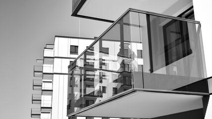 Detail of modern residential flat apartment building exterior. Fragment of new luxury house and home complex. Black and white.