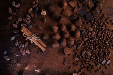 art background with healthy delicious dark truffles, chocolate  and  ingridients:  natural cocoa...