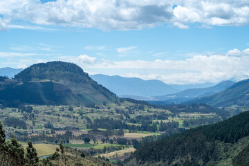 Fototapeta na wymiar beutiful landscape with blue sky and green fields on ecuador 