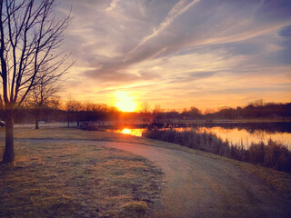 Sunset Over A Walking Path By The Water