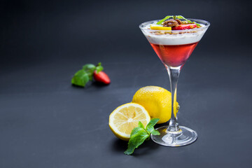 Italian dessert panna cotta with strawberries and lemon