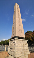 Obraz premium The Egyptian obelisk seen closeup with its elegant carving on red granite.