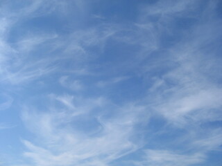 beautiful blue sky with white haze of clouds