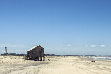 Wooden house on the beach by the sea
