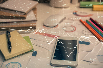 Double exposure of forex chart drawing and cell phone background. Concept of financial data analysis