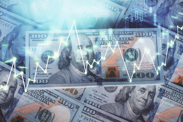 Multi exposure of forex chart drawing over us dollars bill background. Concept of financial success...