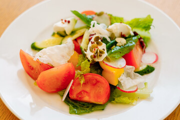 Home made food. Concept for a tasty and healthy meal. Close up. Summer vegetable salad with curd pate and rice chips.