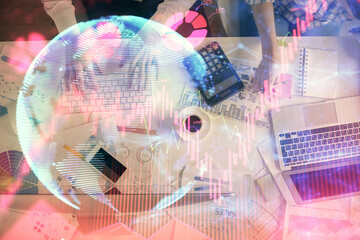 Double exposure of man and woman working together and business theme hologram drawing. Computer background. Top View.