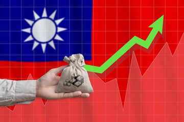 The concept of economic growth in Taiwan Province. Hand holds a bag with money and an upward arrow