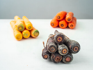 Variety of Purple, Yellow and Orange Carrots Tied Together
