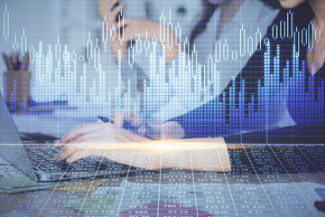 Multi exposure of woman hands typing on computer and financial graph hologram drawing. Stock market analysis concept.