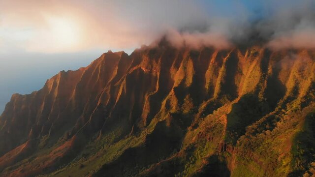 Bird's-eye view of white clouds ant the top of the ridge in Waimea Canyon, Kauai, Hawaii