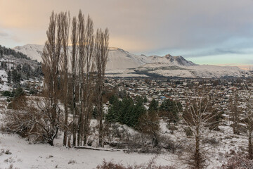 Scene view of Esquel city covered by snow after snowstorm during winter season, Patagonia, Argentina