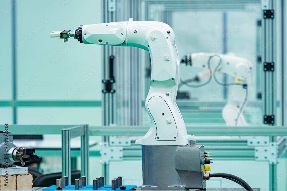 Poster assembly robots are being tested in the laboratory. industrial robots for the assembly of devices. a