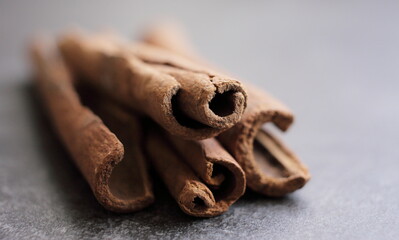 Scented cinnamon sticks on gray concrete countertop