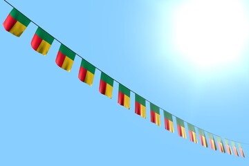 cute many Benin flags or banners hangs diagonal on string on blue sky background with selective focus - any holiday flag 3d illustration..