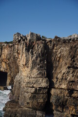 Fototapeta na wymiar Cliffs in Cascais, beautiful coastal city in Portugal near of Lisbon. Europe. 