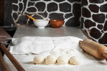 Proofing buns on the table with baked buns and bread. Close-up with copy space. traditional turkish cuisine