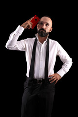 Clever hispanic young man with a red smartphone having an idea