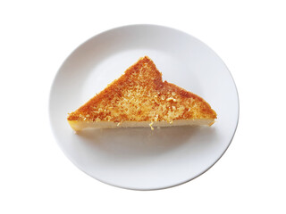 Slice of toasted bread with butter on plate isolated on white background.