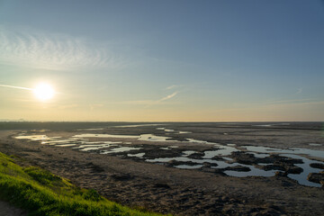Wooden fence on a field / Sunset on the beach / sunset over the river