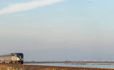 train on the railway / Wooden fence on a field / Sunset on the beach / sunset over the river