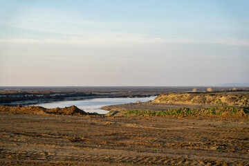 Wooden fence on a field / Sunset on the beach / sunset over the river