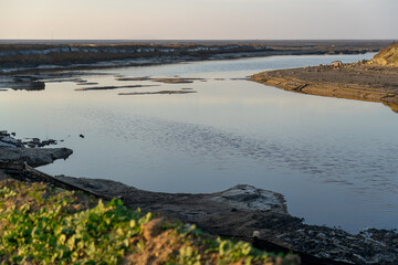 Wooden fence on a field / Sunset on the beach / sunset over the river